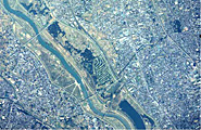 The accommodation of environmental preservation and societal infrastructure is an urgent task of the 21st century. Aerial photograph of the environment of Saitama University.
